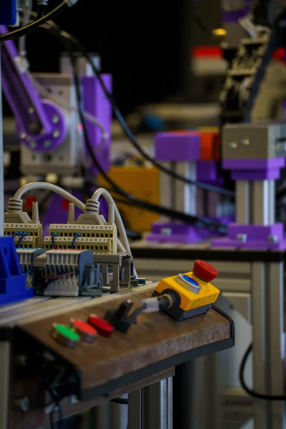 Industrial automation control equipment with wiring and emergency-stop controls.